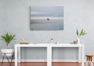 Coastal seascape photo print of people walking on a beach with distant mountains. Beach photography.