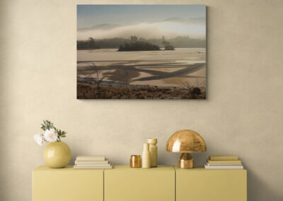 Cozy living room with yellow cabinet, art print, and decorative accessories.