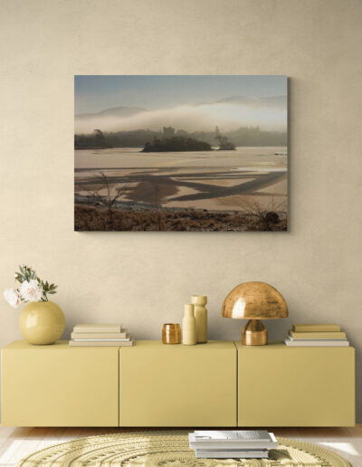 Cozy living room with yellow cabinet, art print, and decorative accessories.