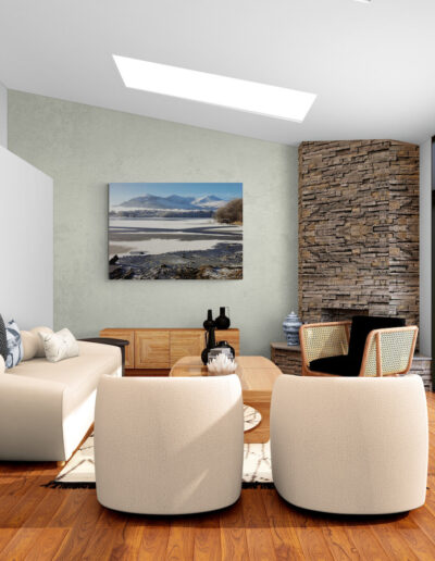 Modern living room with stone fireplace, contemporary furniture, and large window overlooking nature.