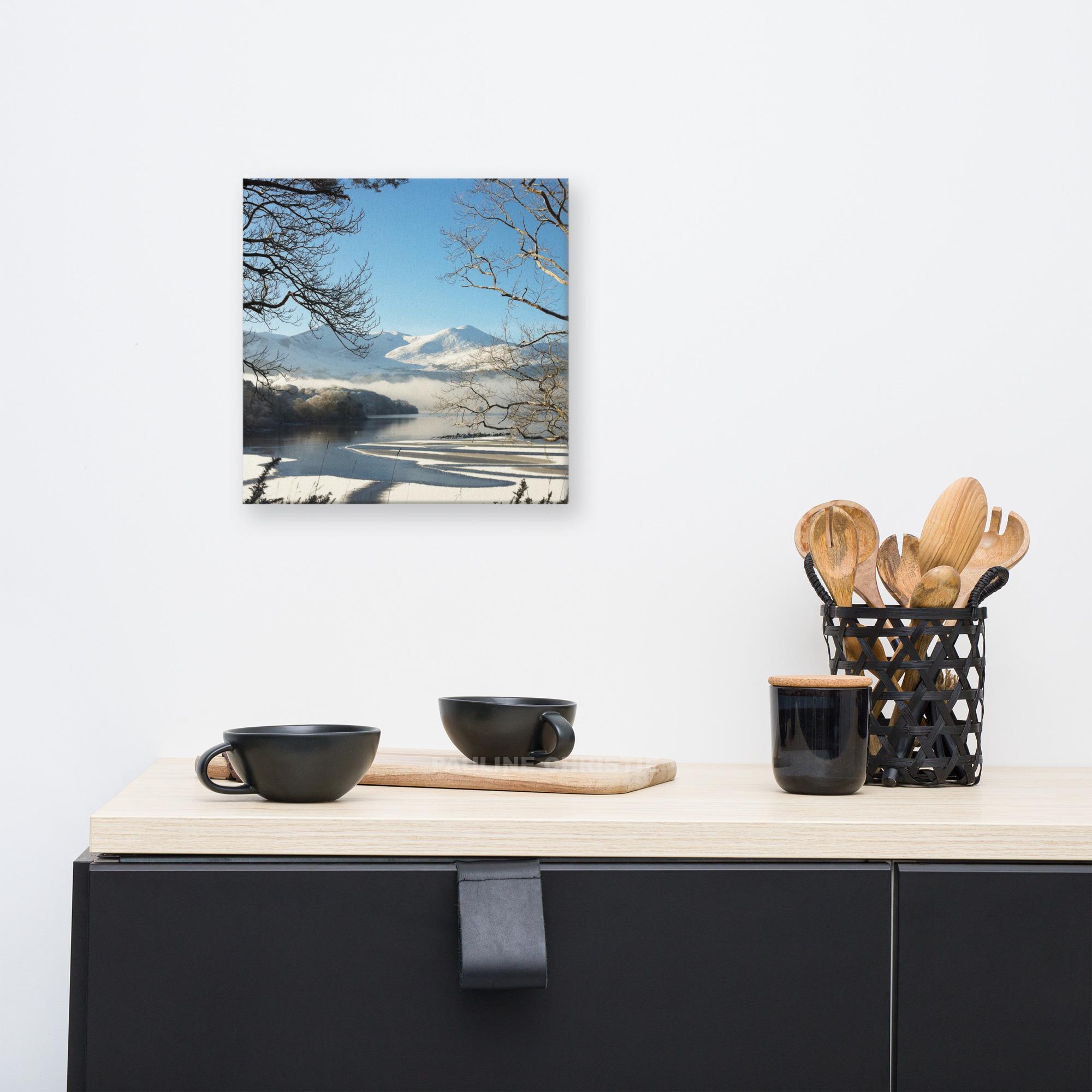 Magical winter lake scene with snow-covered mountains and frosted trees.
