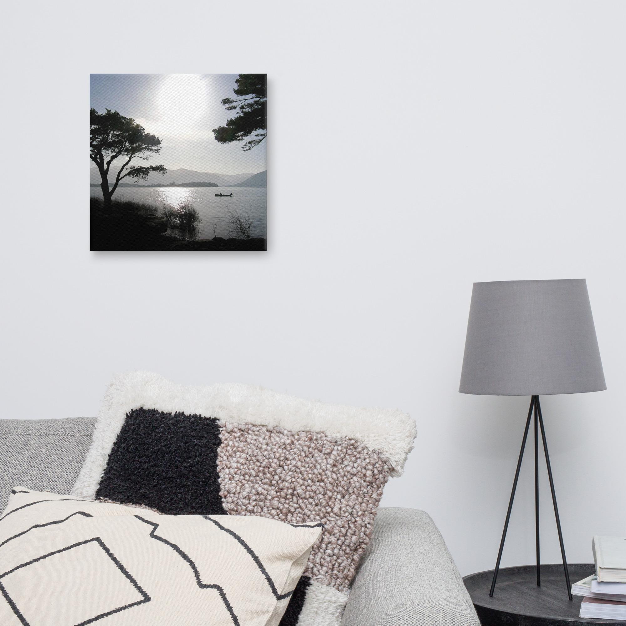 Silhouette of a fisherman out on the lakes of Killarney at sunset