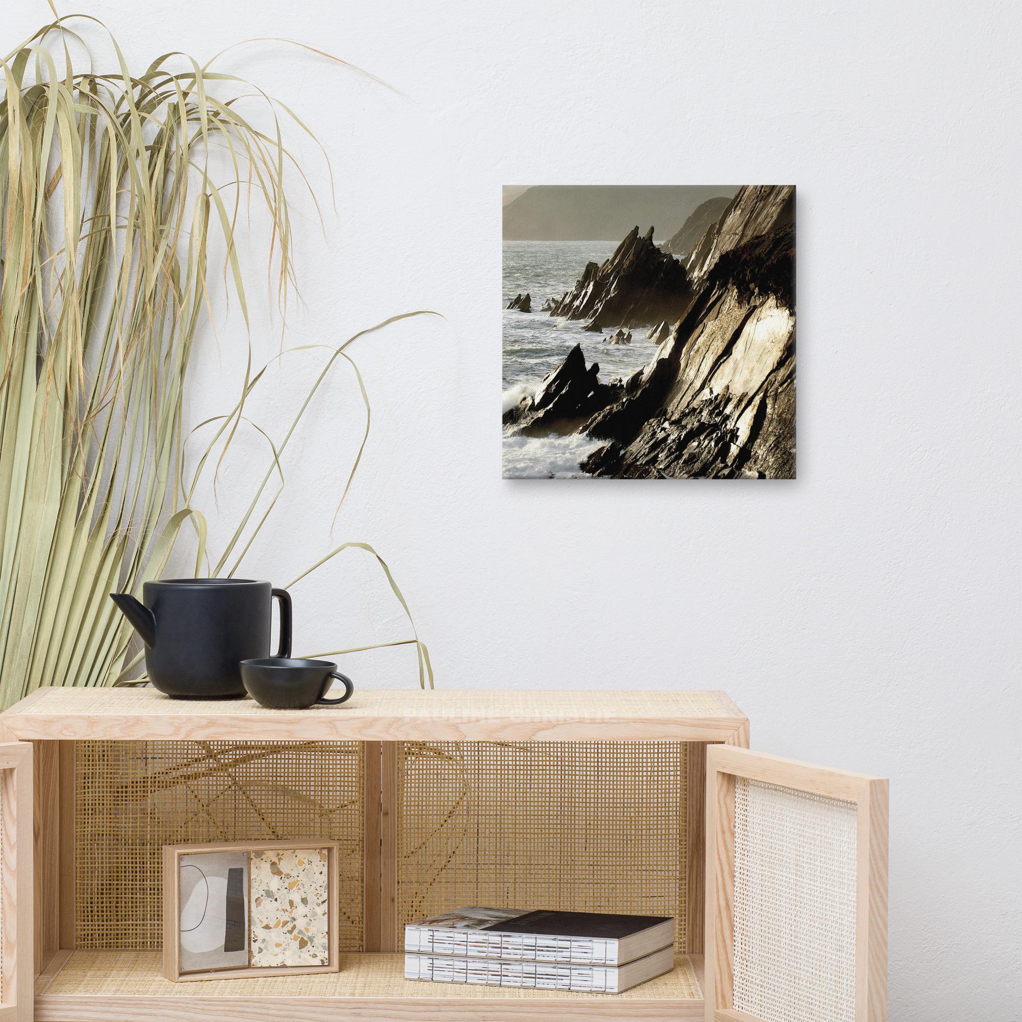 Coastal rocks at Couminole Kerry, with waves crashing against the rugged shoreline.