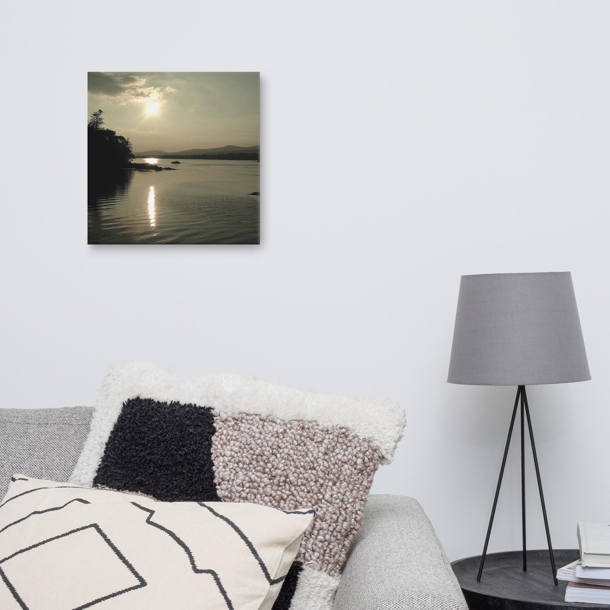 Sunset over Kenmare Bay, with reflections on the water.