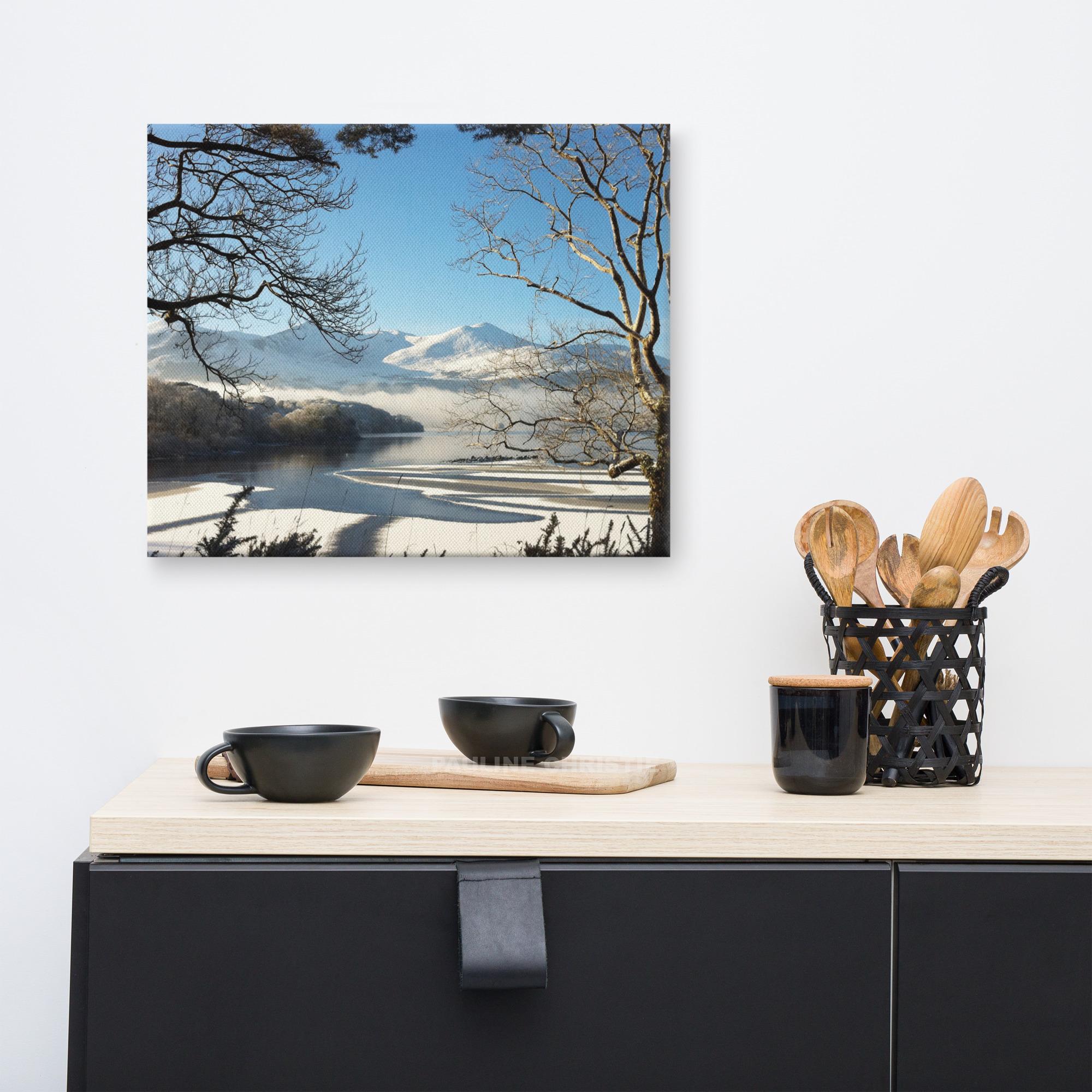 Magical winter lake scene with snow-covered mountains and frosted trees.