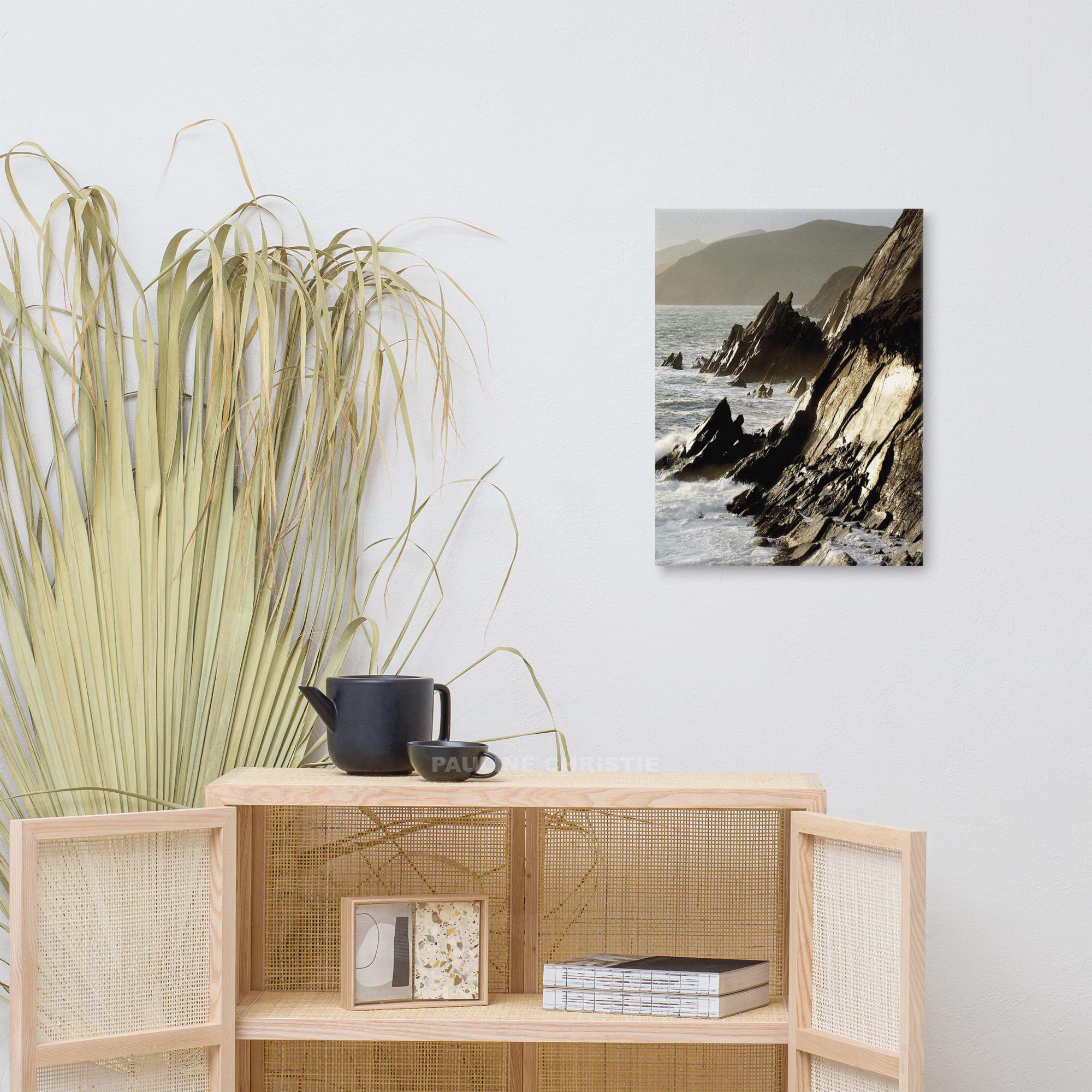 Coastal rocks at Couminole Kerry, with waves crashing against the rugged shoreline.