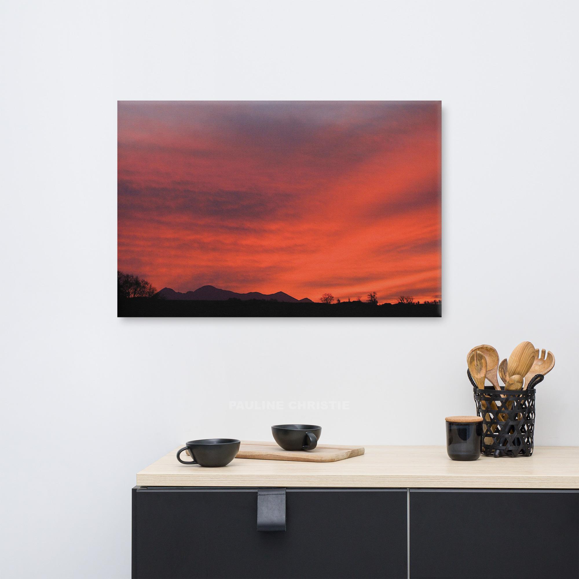 Vibrant red sky over silhouetted Carrauntoohil mountains in Kerry