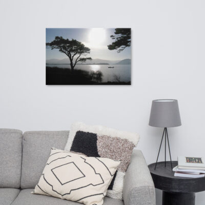 Silhouette of a fisherman out on the lakes of Killarney at sunset