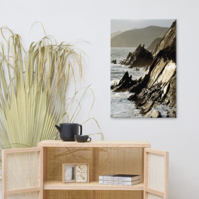Coastal rocks at Couminole Kerry, with waves crashing against the rugged shoreline.