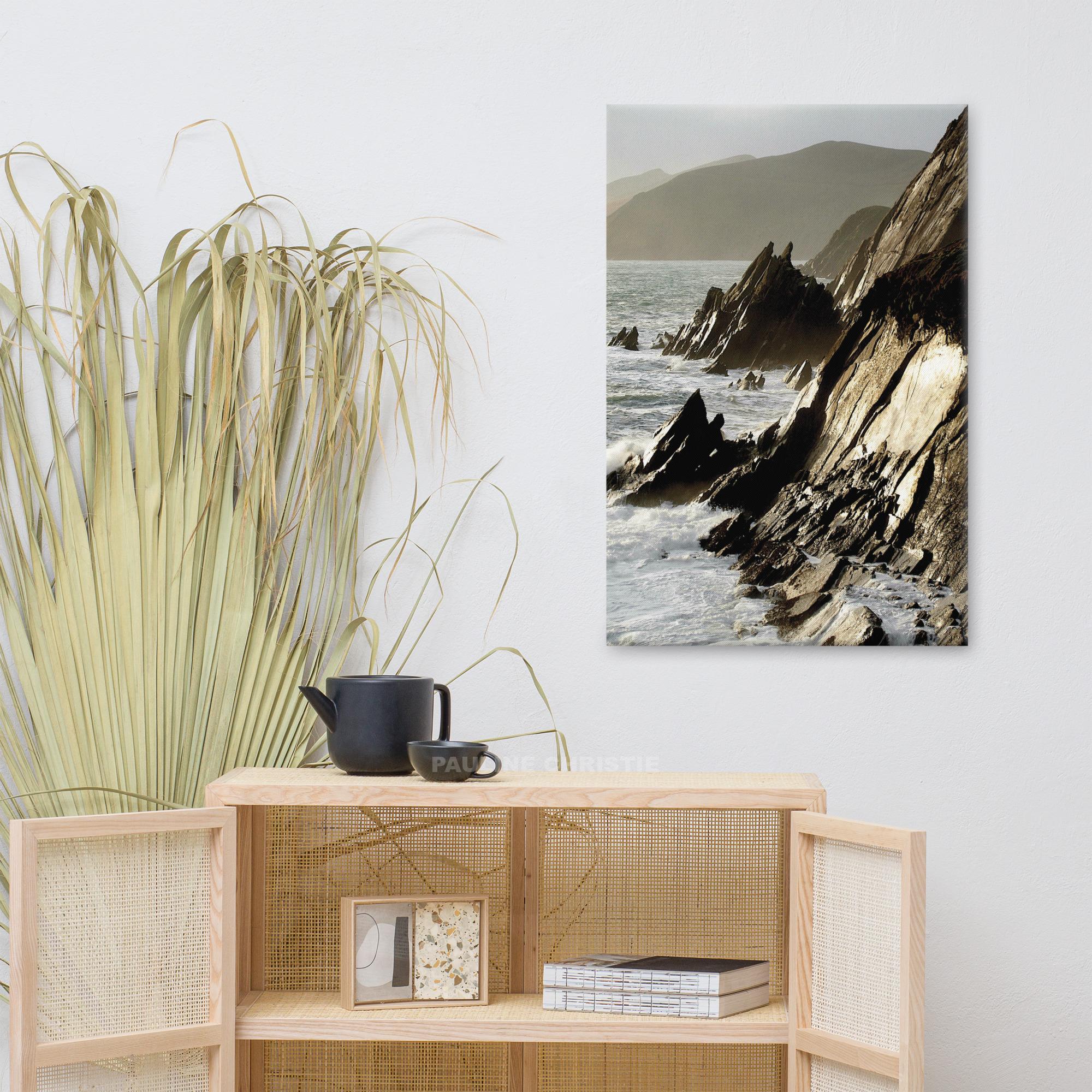 Coastal rocks at Couminole Kerry, with waves crashing against the rugged shoreline.